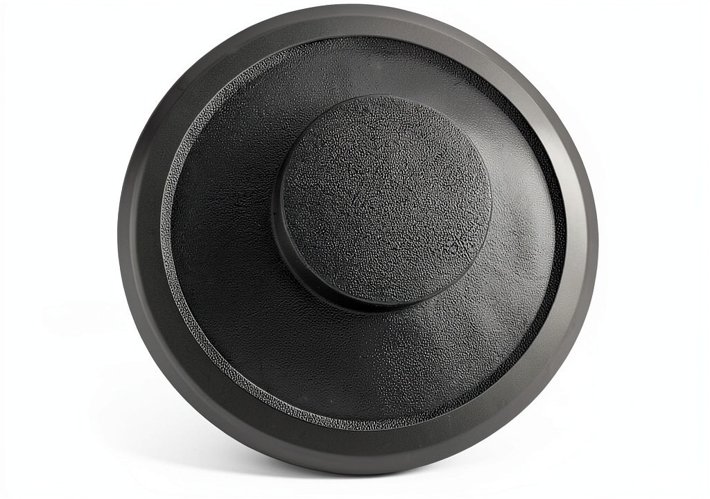 SMLBJUTE Black Plastic Sink Plug Drain Stopper placed in a stainless steel sink